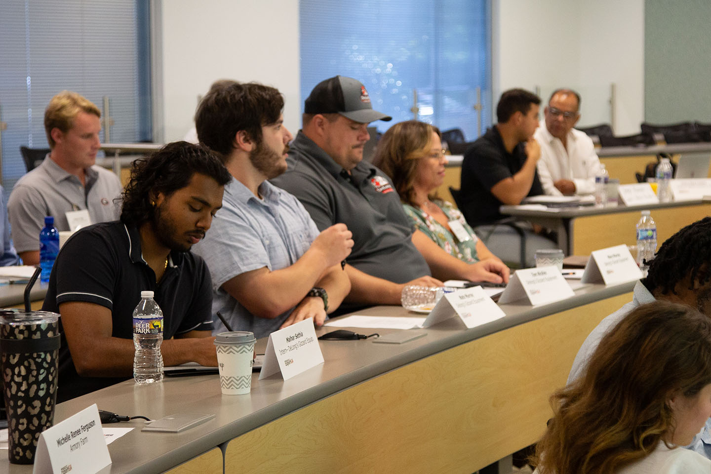 small business owners listen to presentation in a classroom