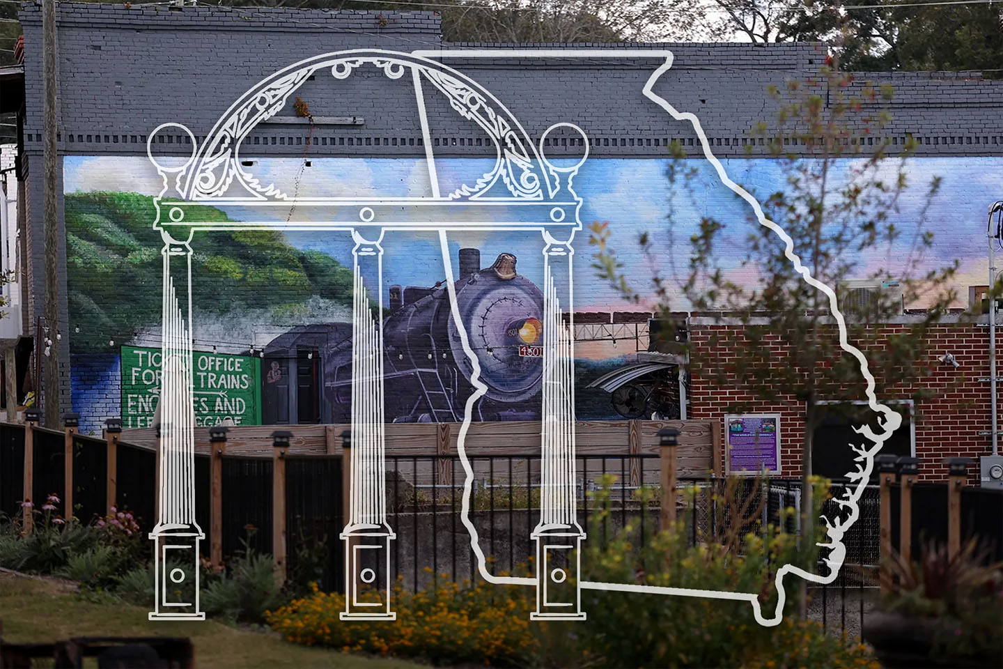 A mural in hartwell with a watermark of the UGA arch and outline of the state of Georgia