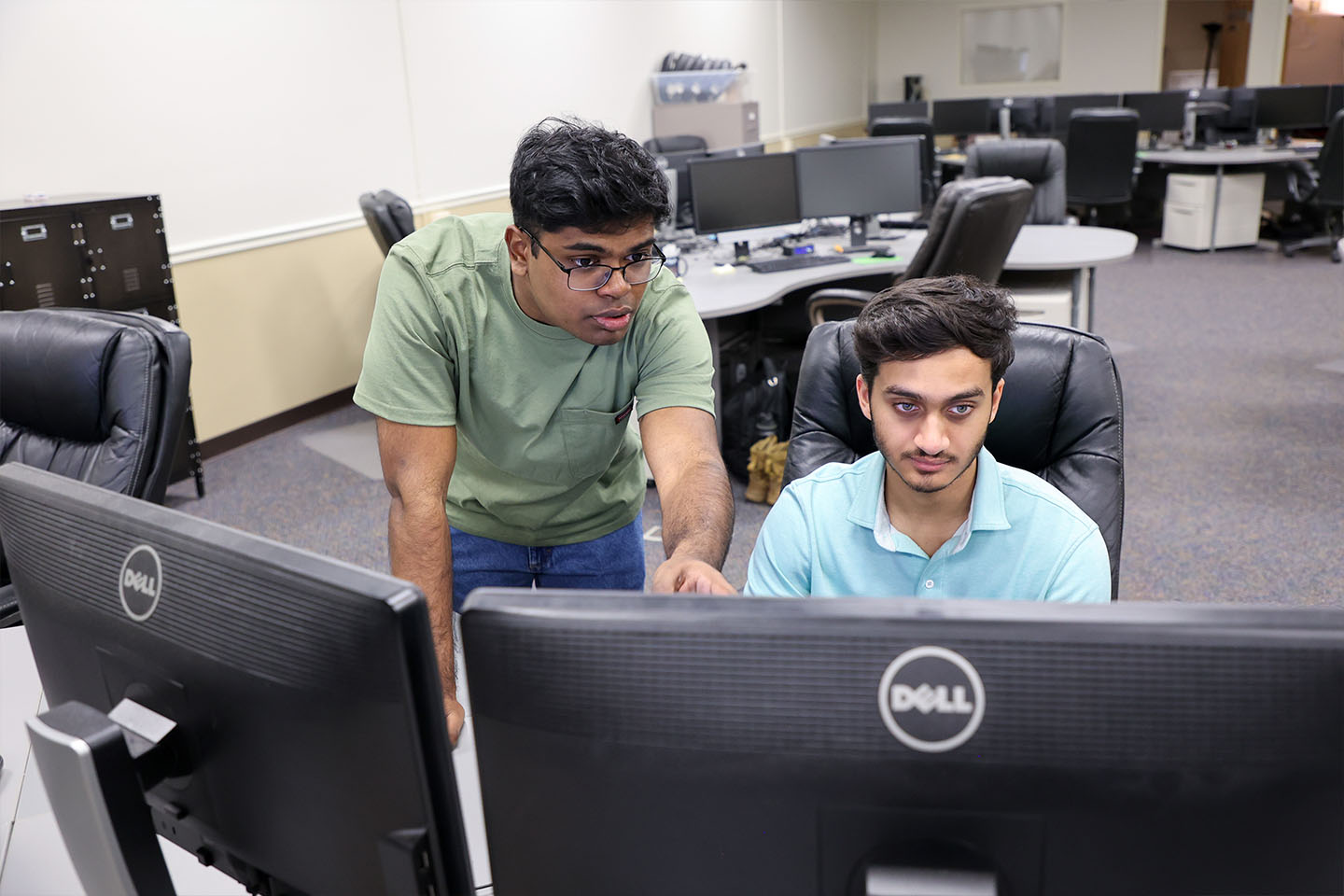 two CyberArch interns at a computer