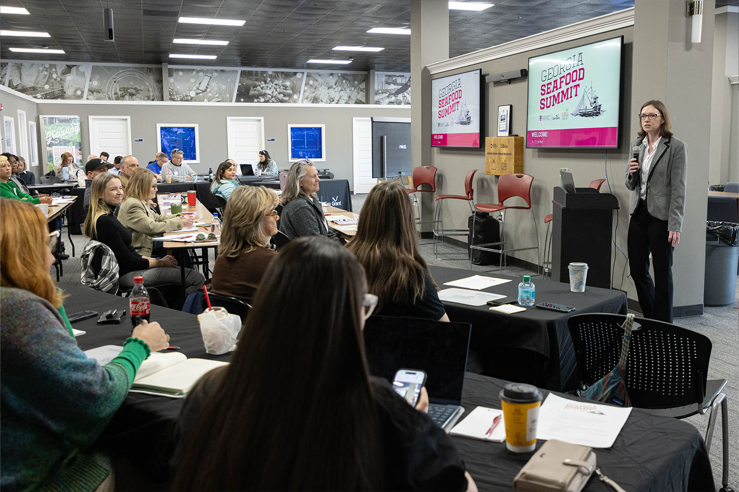 erin arneson speaks to participants at the georgia seafood summit
