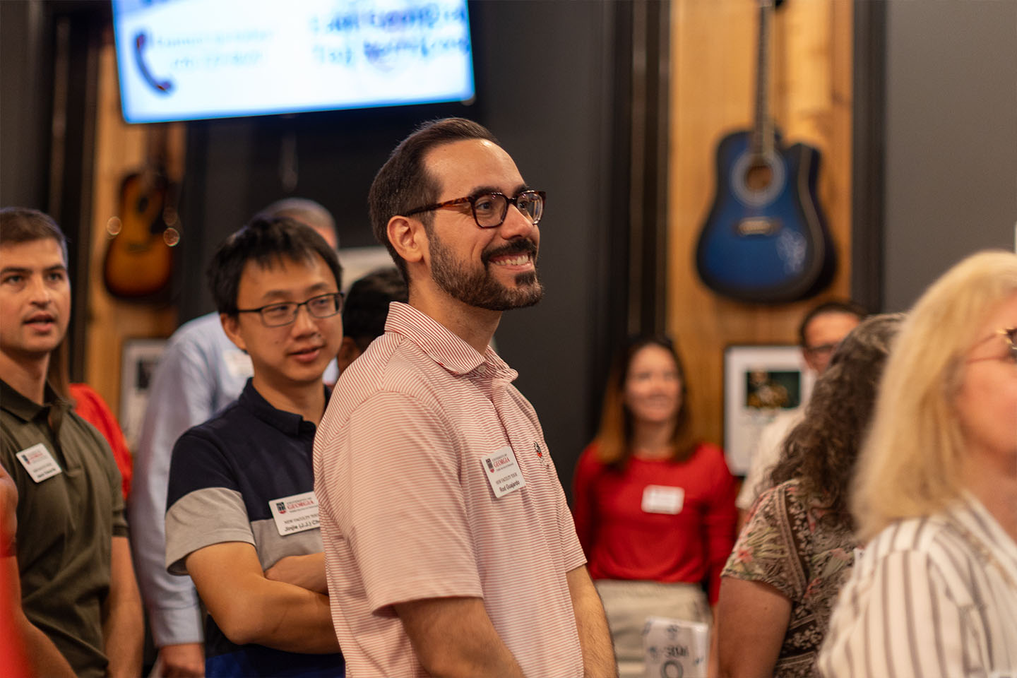 rob listen to a speaker on new faculty tour
